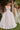 Model is posing in the Cinderella Divine CD862W wedding dress